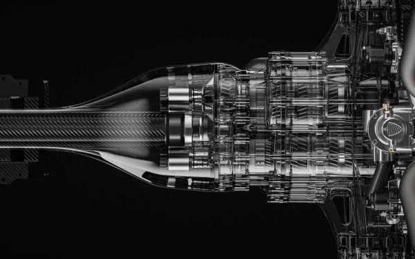 HD desktop wallpaper featuring a detailed black-and-white image of the intricate engine mechanics of a Koenigsegg Gemera.