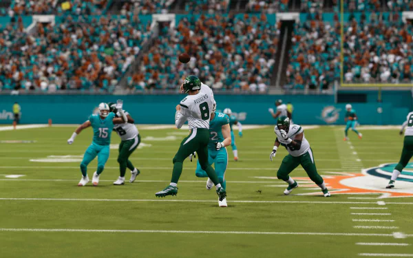 HD desktop wallpaper from Madden NFL 24, featuring a dynamic in-game scene of players on the football field during a play.