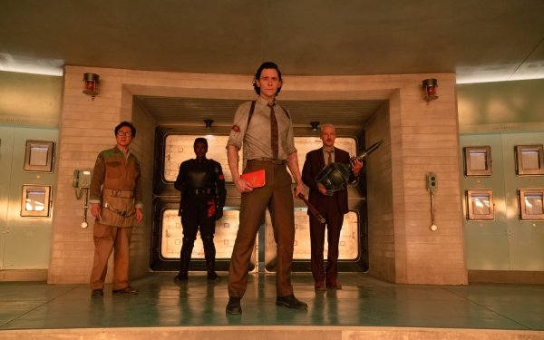 HD desktop wallpaper featuring the character Loki, played by actor Tom Hiddleston, along with other characters from Marvel's Loki Season 2, standing confidently in a retro-futuristic setting.