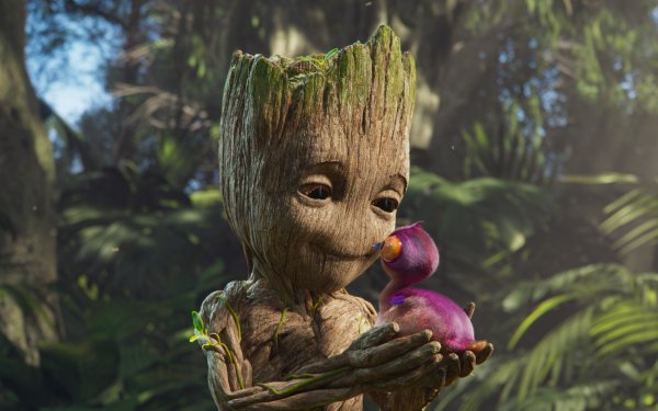HD desktop wallpaper featuring the character Groot holding a small creature, set against a lush forest backdrop, perfect for Groot fans.