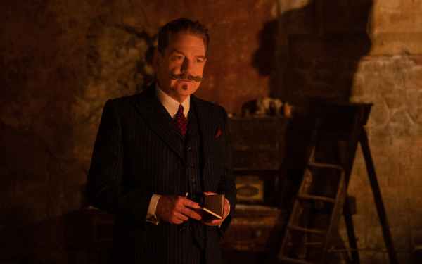 HD desktop wallpaper featuring a man in a pinstripe suit and mustache from A Haunting in Venice for a moody, atmospheric background.