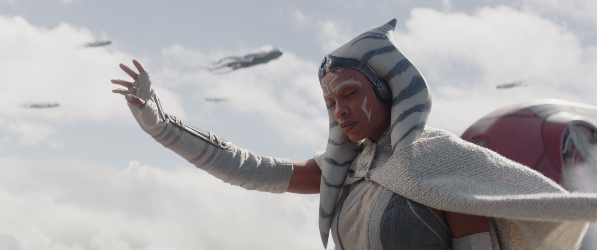 HD wallpaper featuring Ahsoka Tano with an outstretched hand, sky backdrop, and a starship.