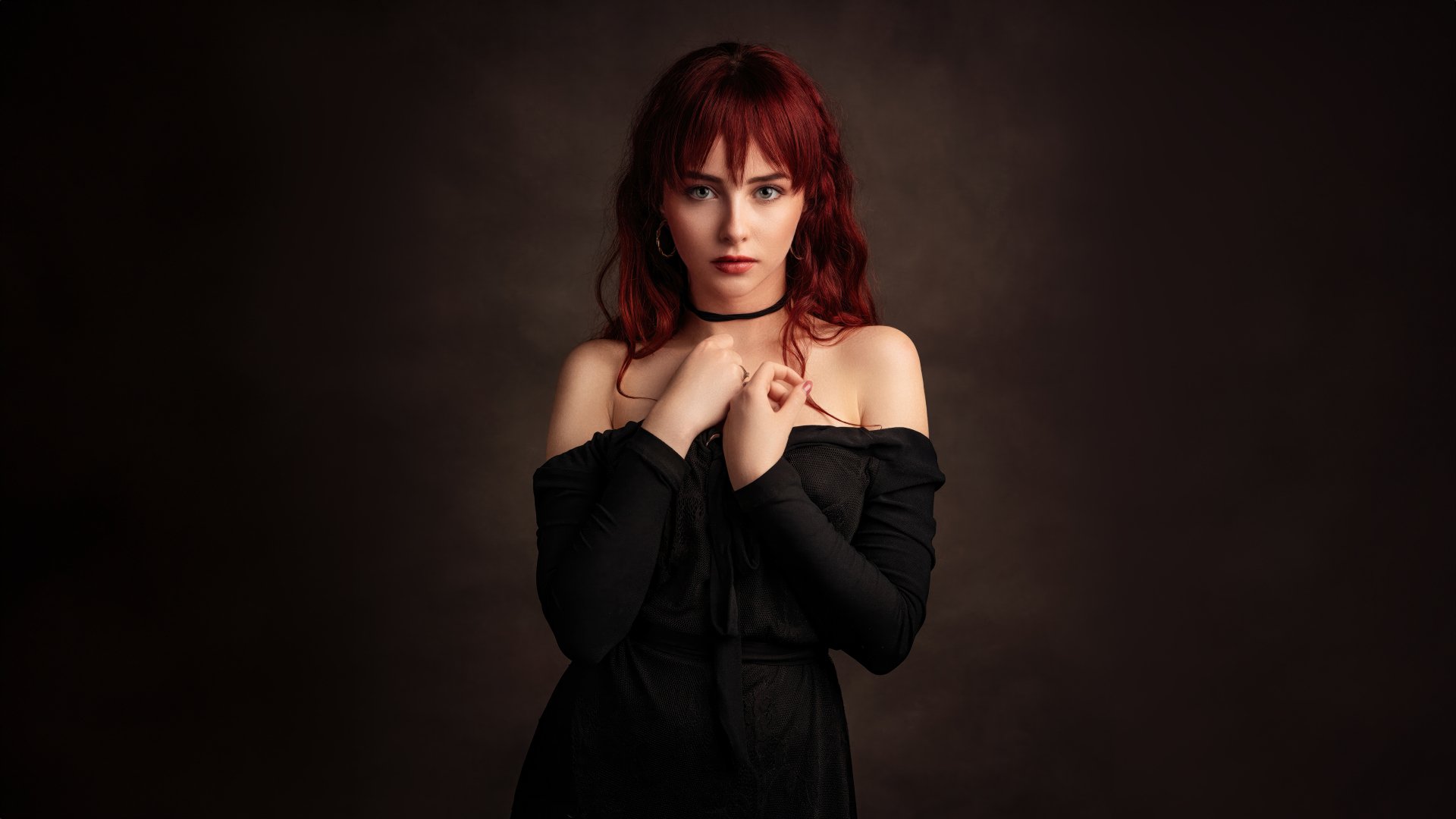 Portrait of a red-haired woman model in a black off-shoulder outfit against a dark background, captured in 4K Ultra HD quality for PC desktop wallpaper.