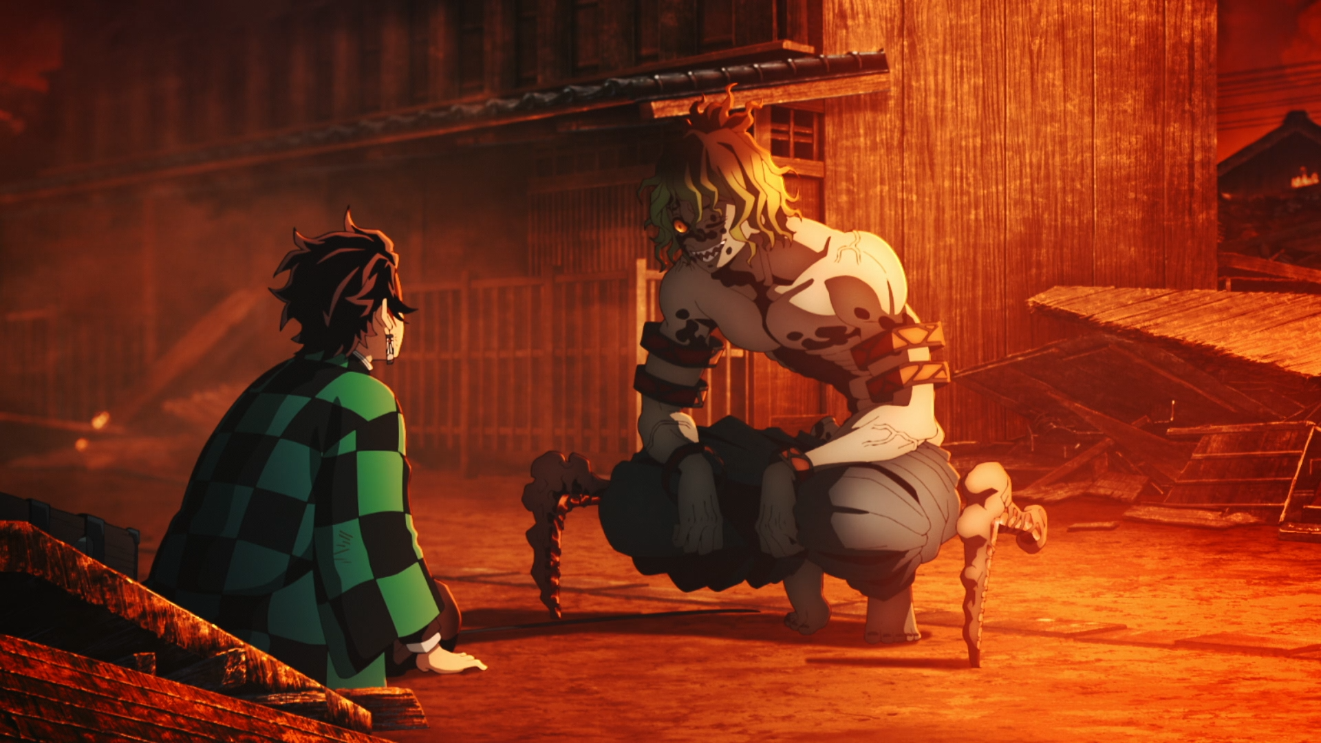 HD anime wallpaper featuring Tanjiro Kamado facing Gyutaro from Demon Slayer: Kimetsu no Yaiba in a dimly lit, intense scene.