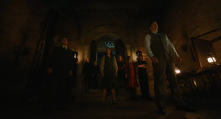 A Haunting in Venice wallpaper showcasing a tense scene with characters positioned in a dimly lit setting, accentuated by shadows and atmospheric lighting, creating an eerie vibe.