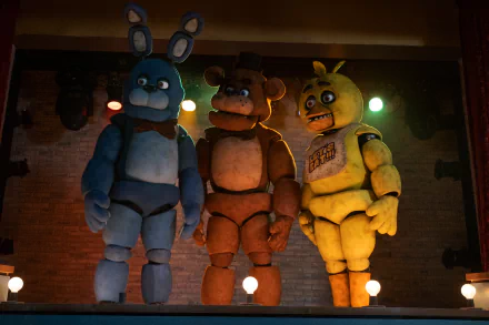 HD wallpaper of Five Nights at Freddy's characters Bonnie, Freddy, and Chica on stage for desktop background.