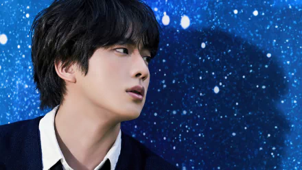 A captivating HD wallpaper featuring Kim Seok-jin from BTS, set against a stunning starry background, showcasing his profile with an expressive gaze.