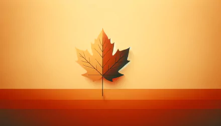 HD desktop wallpaper featuring a minimalist design of a single leaf in fall colors against a smooth gradient background.