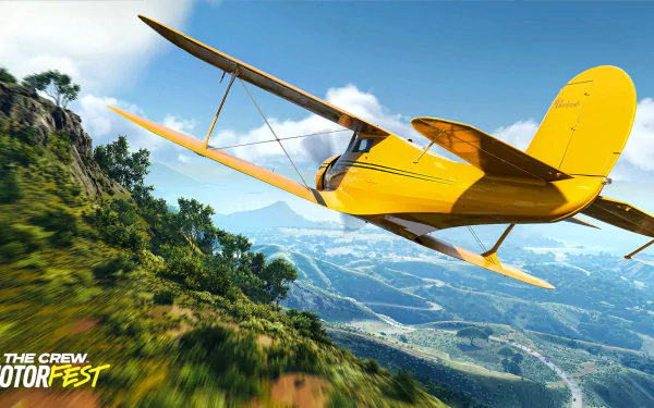 A vibrant HD wallpaper from The Crew Motorfest, featuring a yellow airplane soaring over lush green landscapes and mountains, showcasing the thrill of aerial exploration in the game.