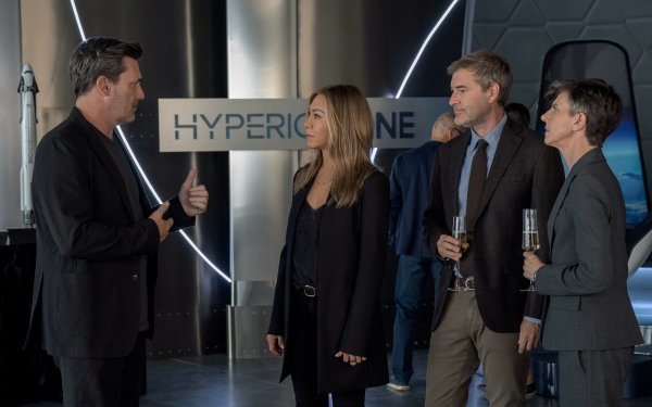 HD wallpaper of a scene from The Morning Show featuring four people having a discussion in a modern setting with the text 'HYPERIONE' in the background.
