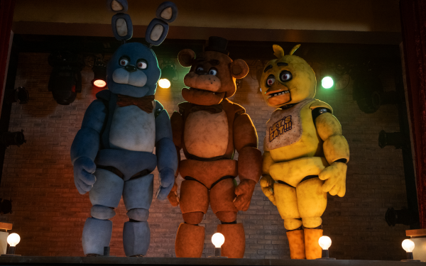 HD wallpaper of Five Nights at Freddy's characters Bonnie, Freddy, and Chica on stage for desktop background.