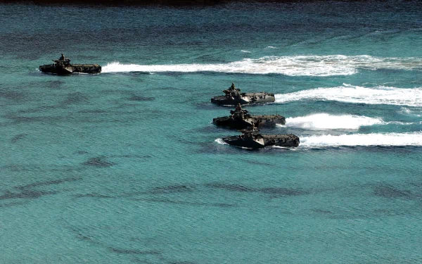 A striking HD wallpaper featuring military amphibious vehicles navigating through clear blue waters, showcasing their agility and power in a dynamic scene.