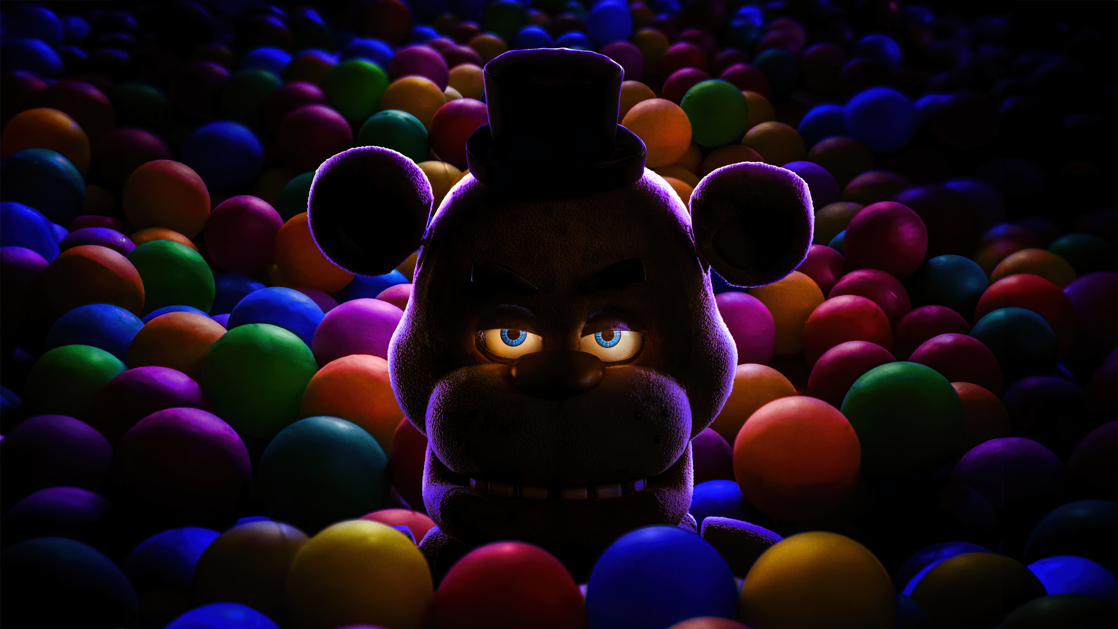 HD desktop wallpaper of Five Nights at Freddy's character peeking out from a colorful ball pit with a sinister expression.