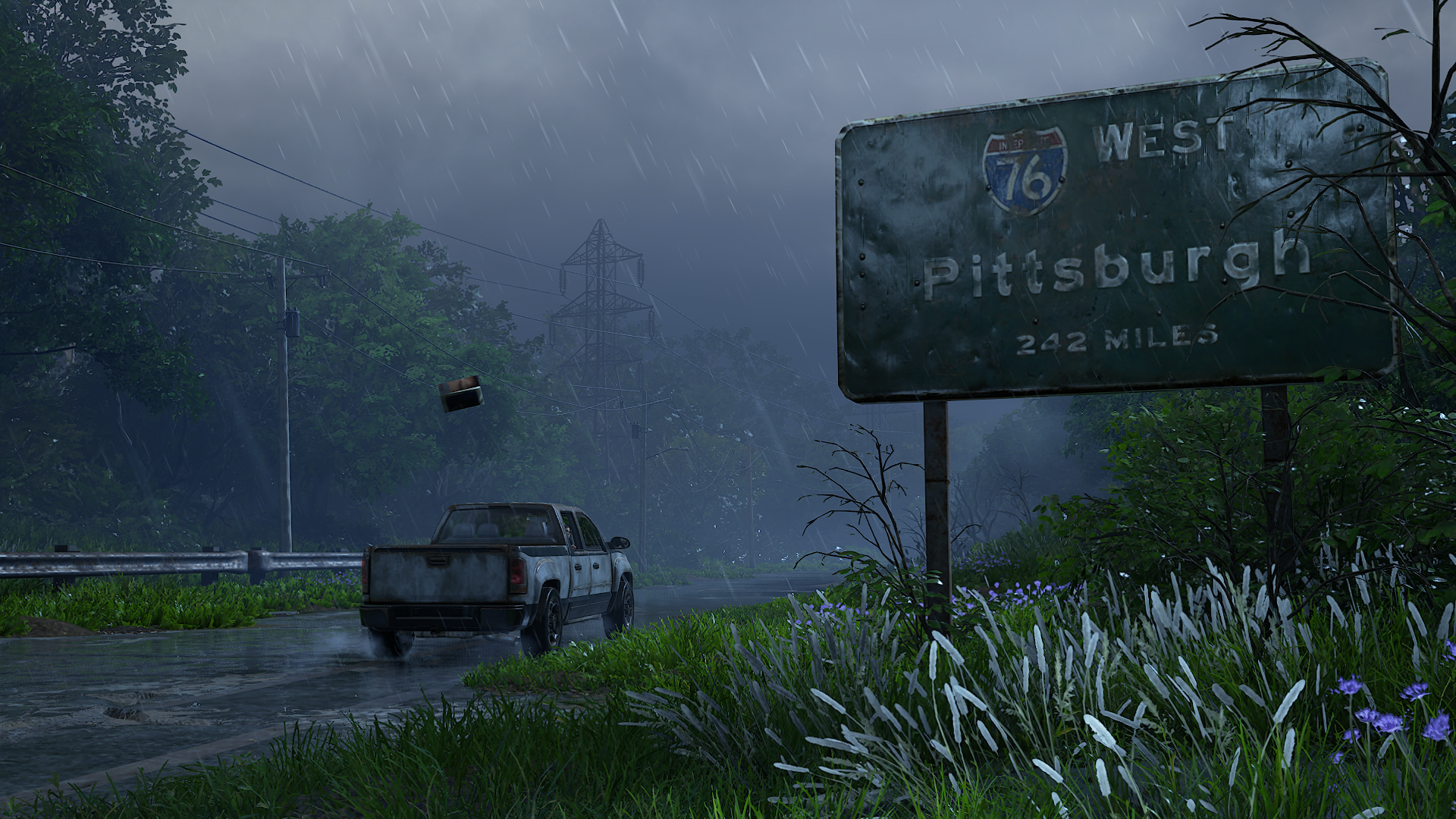 HD PC desktop wallpaper from the video game The Last of Us Part I, featuring a rainy highway scene with a weathered sign indicating Pittsburgh 322 miles west.