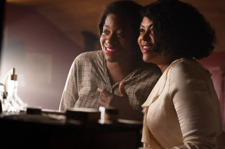 Two women share a joyful moment in a scene from *The Color Purple* (2023). This HD image serves as a captivating desktop wallpaper and background.