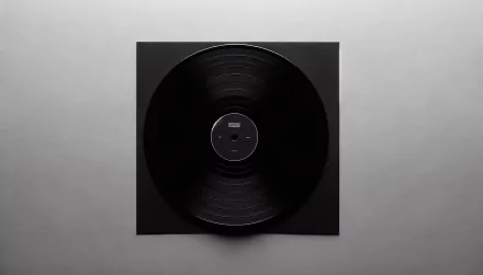 A high-definition desktop wallpaper featuring a classic black vinyl record on a sleek background, showcasing the timeless appeal of music and nostalgia.