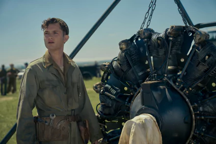 Masters of the Air TV show scene featuring soldier next to airplane engine for HD desktop wallpaper background.