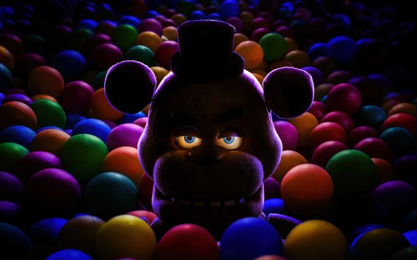 HD desktop wallpaper of Five Nights at Freddy's character peeking out from a colorful ball pit with a sinister expression.