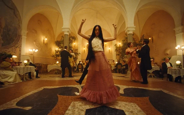 HD wallpaper of a festive ballroom scene from the movie Poor Things with a woman dancing in the foreground.