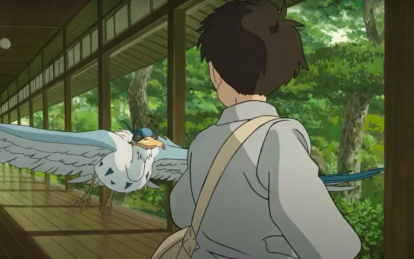 A scenic HD desktop wallpaper featuring a boy watching a heron from Studio Ghibli's 'The Boy and the Heron' amidst a lush forest backdrop.