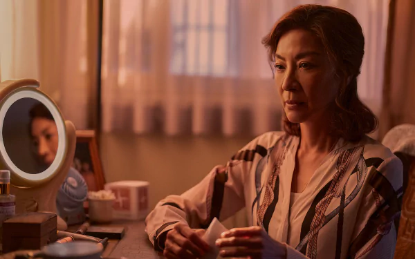 HD wallpaper and desktop background featuring a contemplative character in a warm-lit room from the TV show The Brothers Sun.