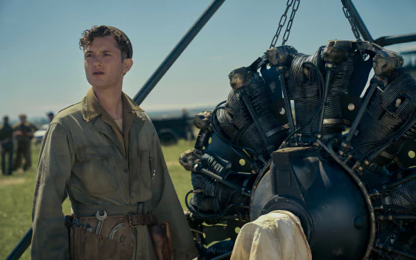 Masters of the Air TV show scene featuring soldier next to airplane engine for HD desktop wallpaper background.
