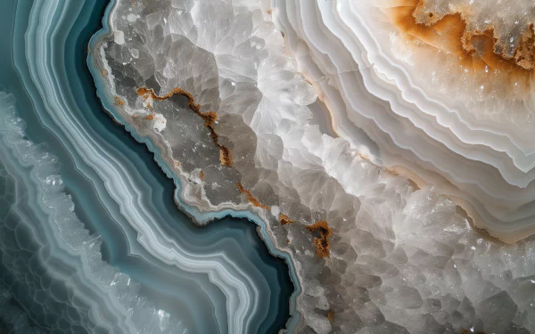 High-definition desktop wallpaper featuring a close-up view of a beautifully layered geode with mesmerizing blue and white crystal patterns.