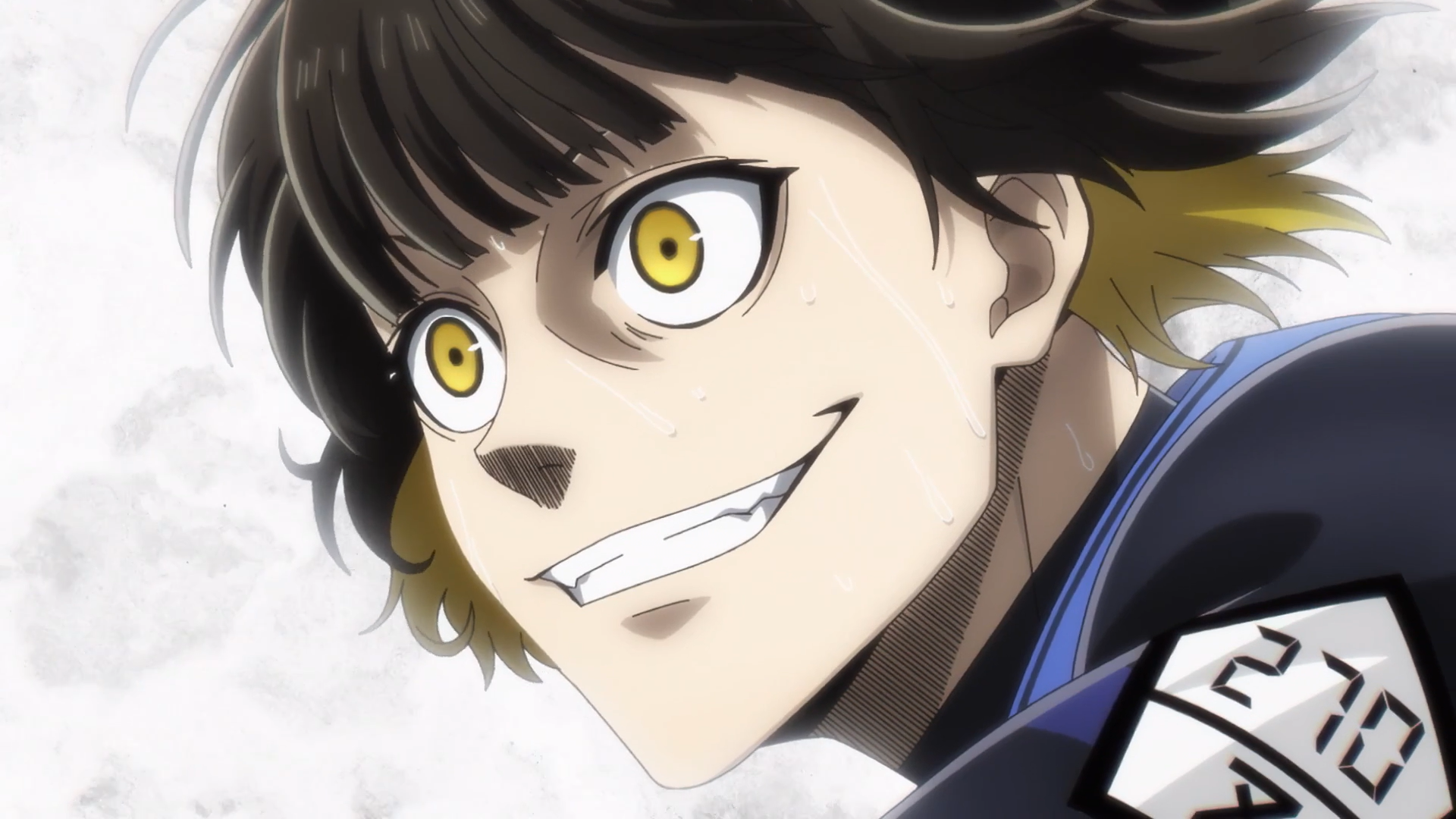 Close-up of Bachira Meguru from Blue Lock with intense yellow eyes and a confident grin, featured in an HD PC desktop wallpaper and background.