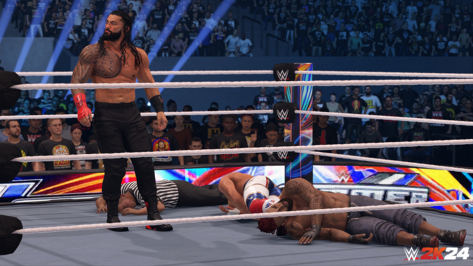 HD desktop wallpaper featuring a WWE 2K24 video game scene with a wrestler standing victorious in the ring while opponents are down.