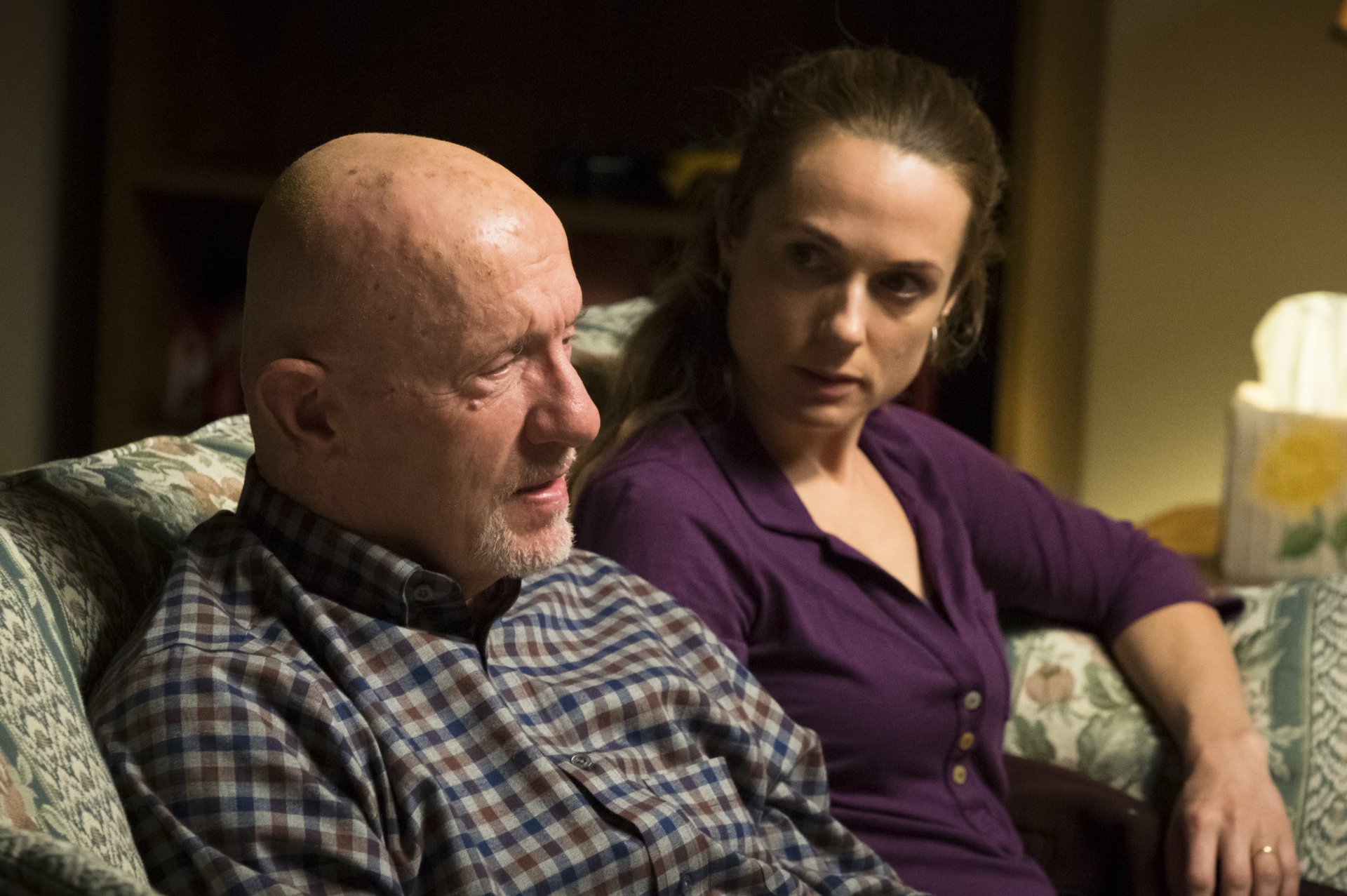 HD desktop wallpaper featuring characters from the TV show Better Call Saul, with a focus scene including two people in a dramatic indoor setting.