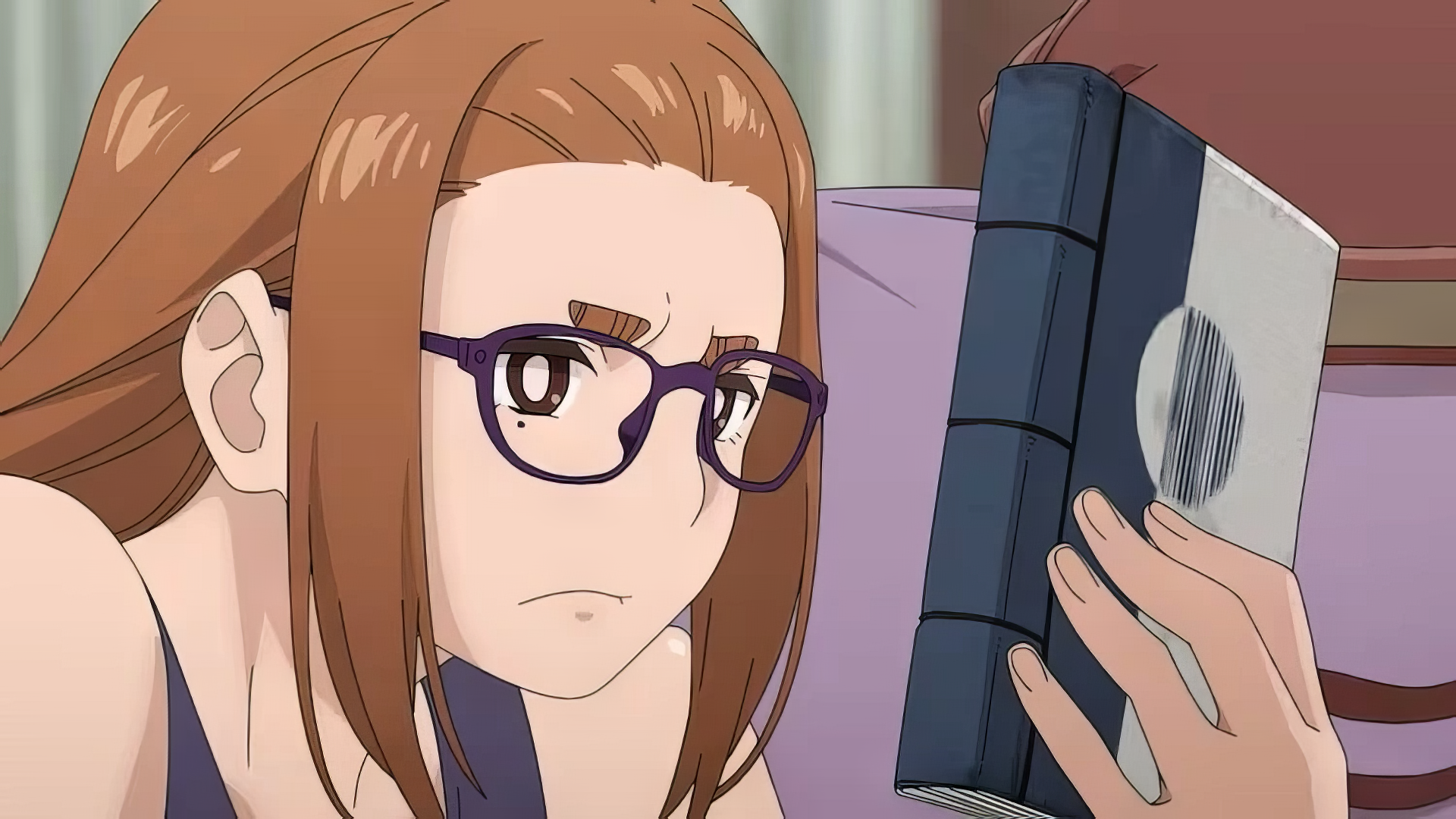 HD wallpaper featuring an anime character, Sumireko Ogawa, with a mysterious and contemplative expression, holding a book close to her face.