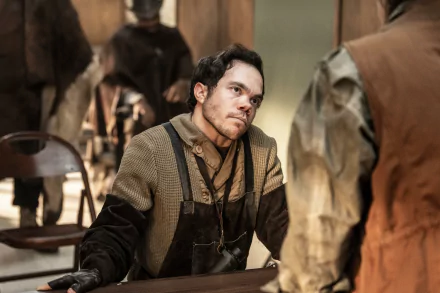 A scene from The Walking Dead: The Ones Who Live, featuring a character in a gritty setting, surrounded by others, captured in detailed HD for a striking desktop wallpaper.