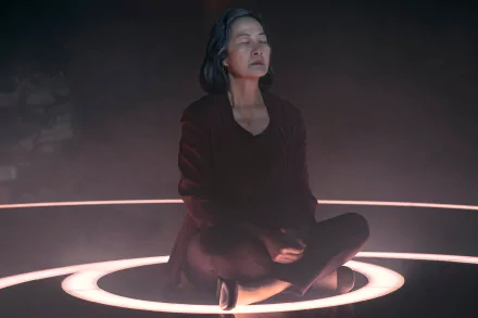 Scene from The Three-Body Problem TV show featuring a character meditating inside a ring of light, available as HD desktop wallpaper and background.
