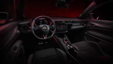 Interior view of an Alfa Romeo Milano Veloce showcasing the steering wheel and dashboard with red ambient lighting, intended as an HD desktop wallpaper and background.