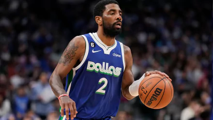 HD desktop wallpaper featuring a Dallas Mavericks basketball player dribbling a ball during a game, wearing a jersey with the number 2.