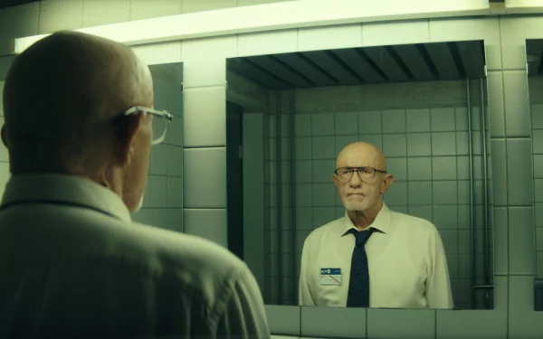HD wallpaper featuring a scene from the TV show Constellation (2024) with a character portrayed by Jonathan Banks, looking at his reflection in a mirror.