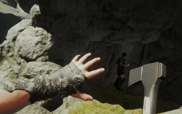 Sons of the Forest game screenshot showing a first-person view of a player with an axe approaching a cave entrance for HD wallpaper.