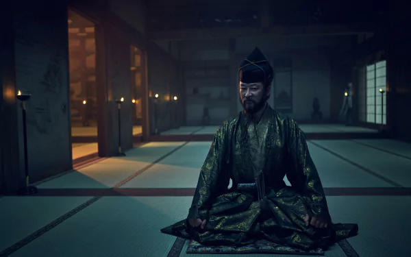HD wallpaper of a character from the 2024 TV show Shogun meditating in a dimly lit traditional room.