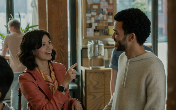 HD wallpaper from The American Society of Magical Negroes TV show, featuring two characters in a friendly conversation.