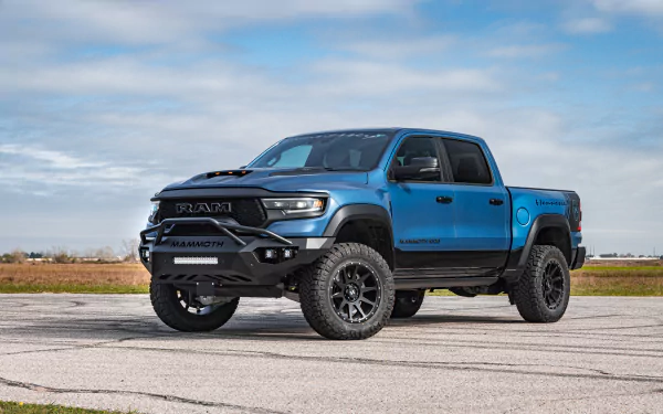 Blue Hennessey Mammoth 1000 Dodge Ram truck displayed as HD desktop wallpaper with clear skies in the background.