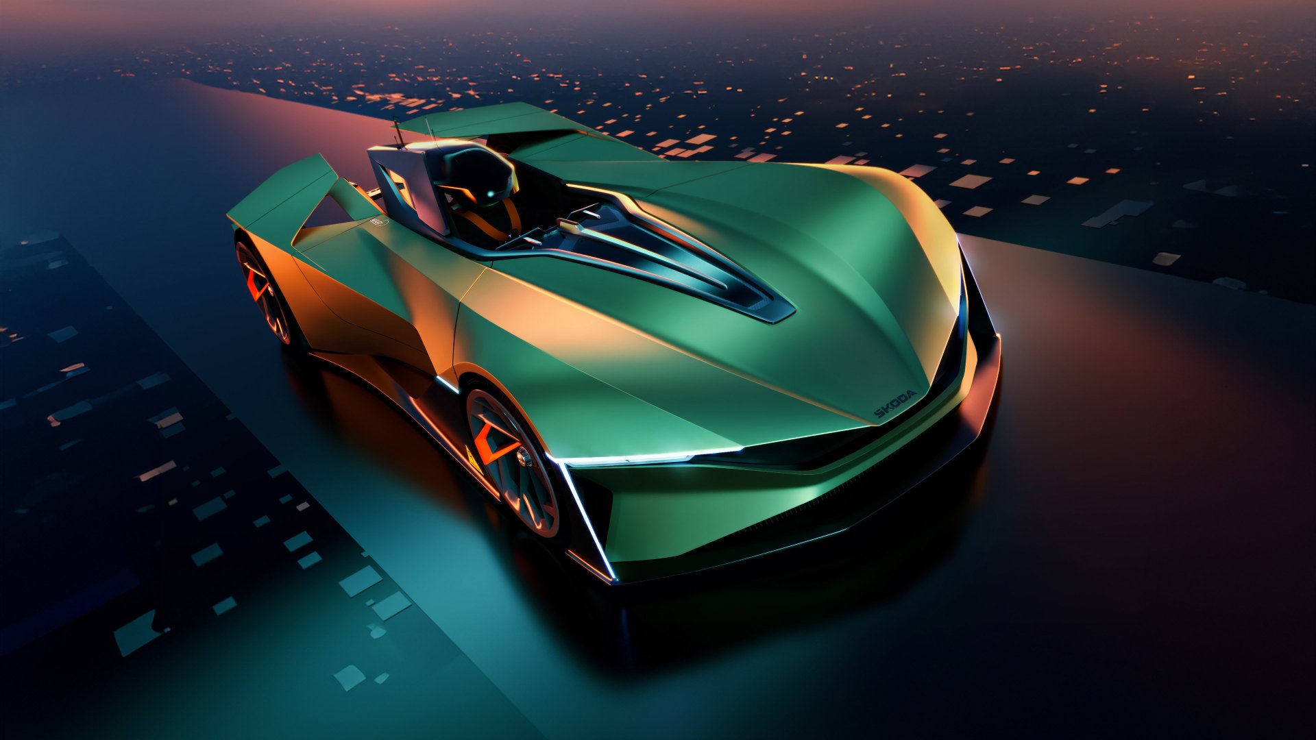 HD wallpaper of a Škoda Vision GT concept car in a dynamic green hue, dramatically illuminated over a cityscape at twilight.