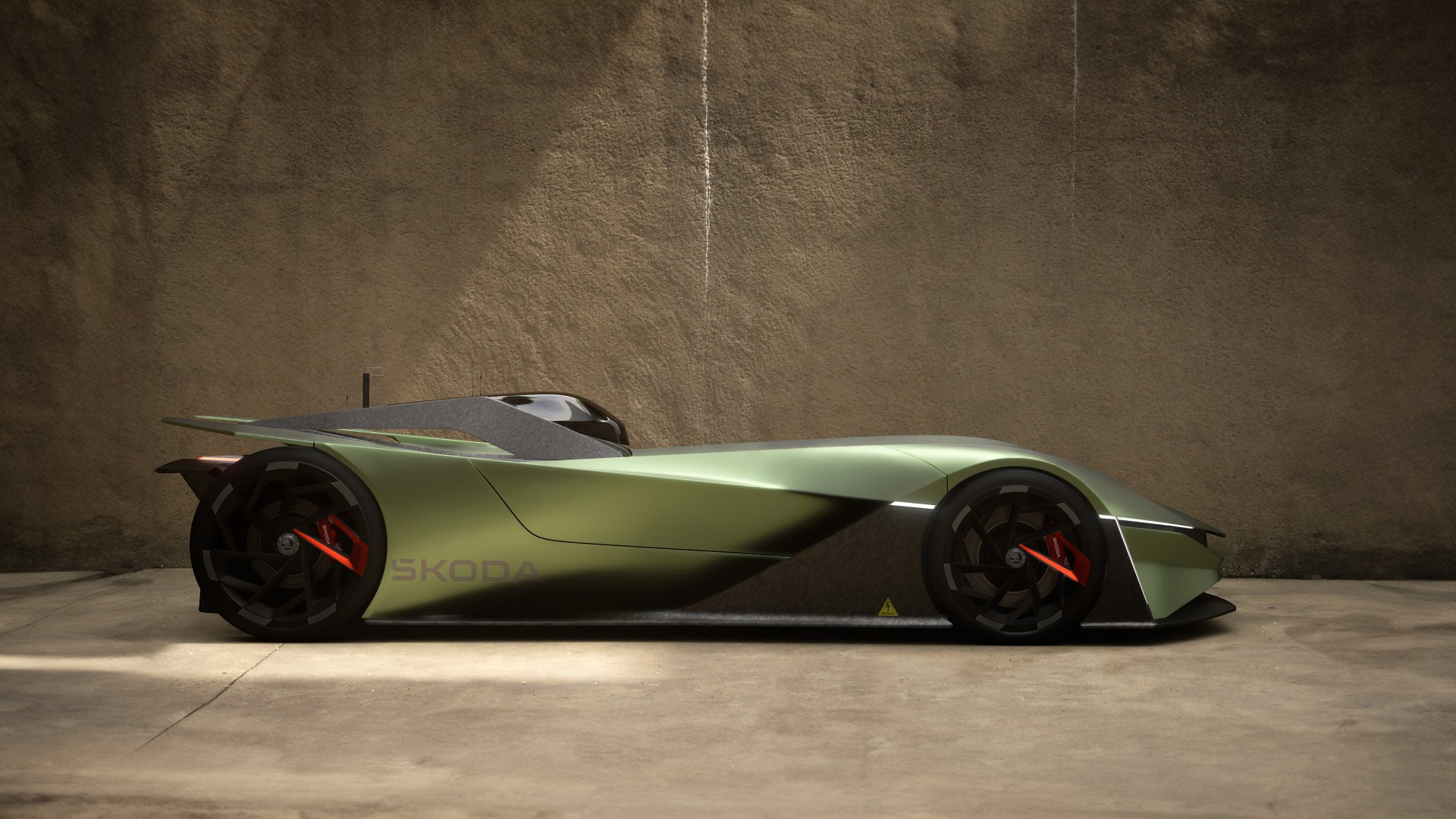 HD desktop wallpaper of a Škoda Vision GT, a sleek green sports car with futuristic design, parked in a minimalist setting.