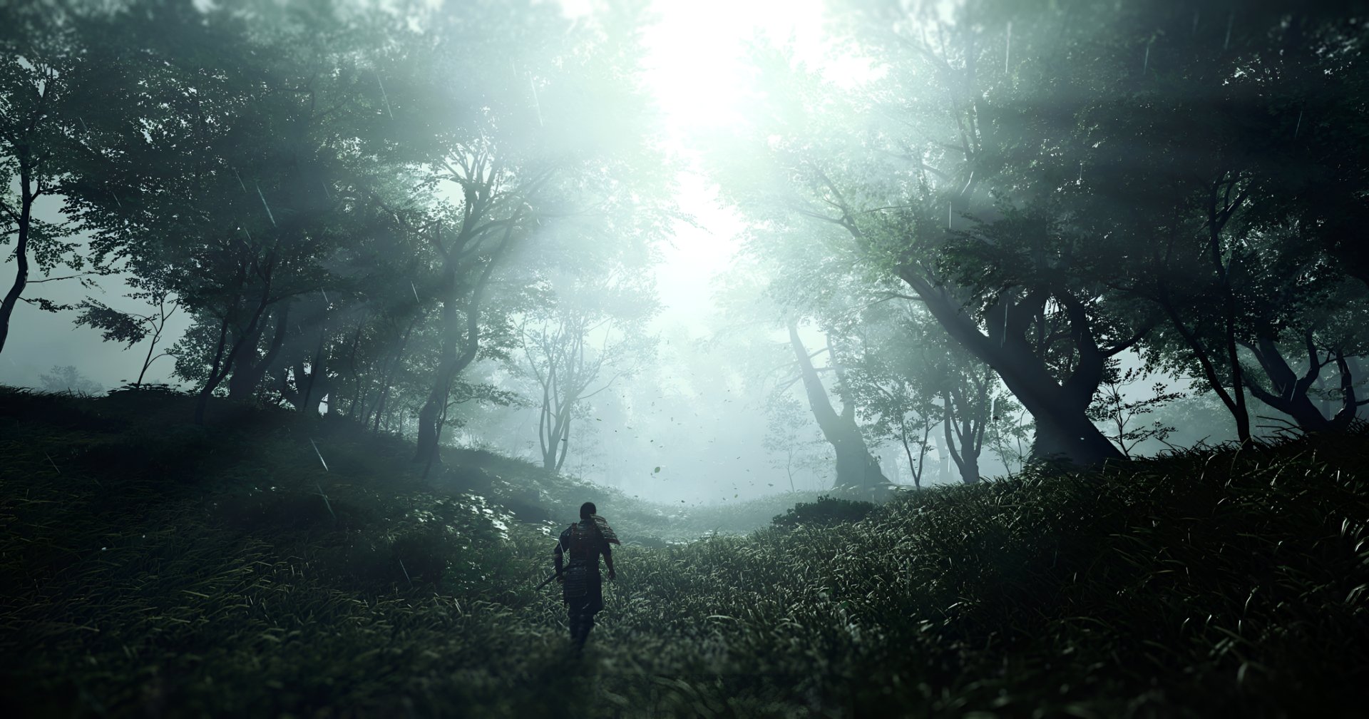 HD desktop wallpaper of the video game Ghost of Tsushima, depicting a lone warrior walking through a misty forest illuminated by rays of sunlight.