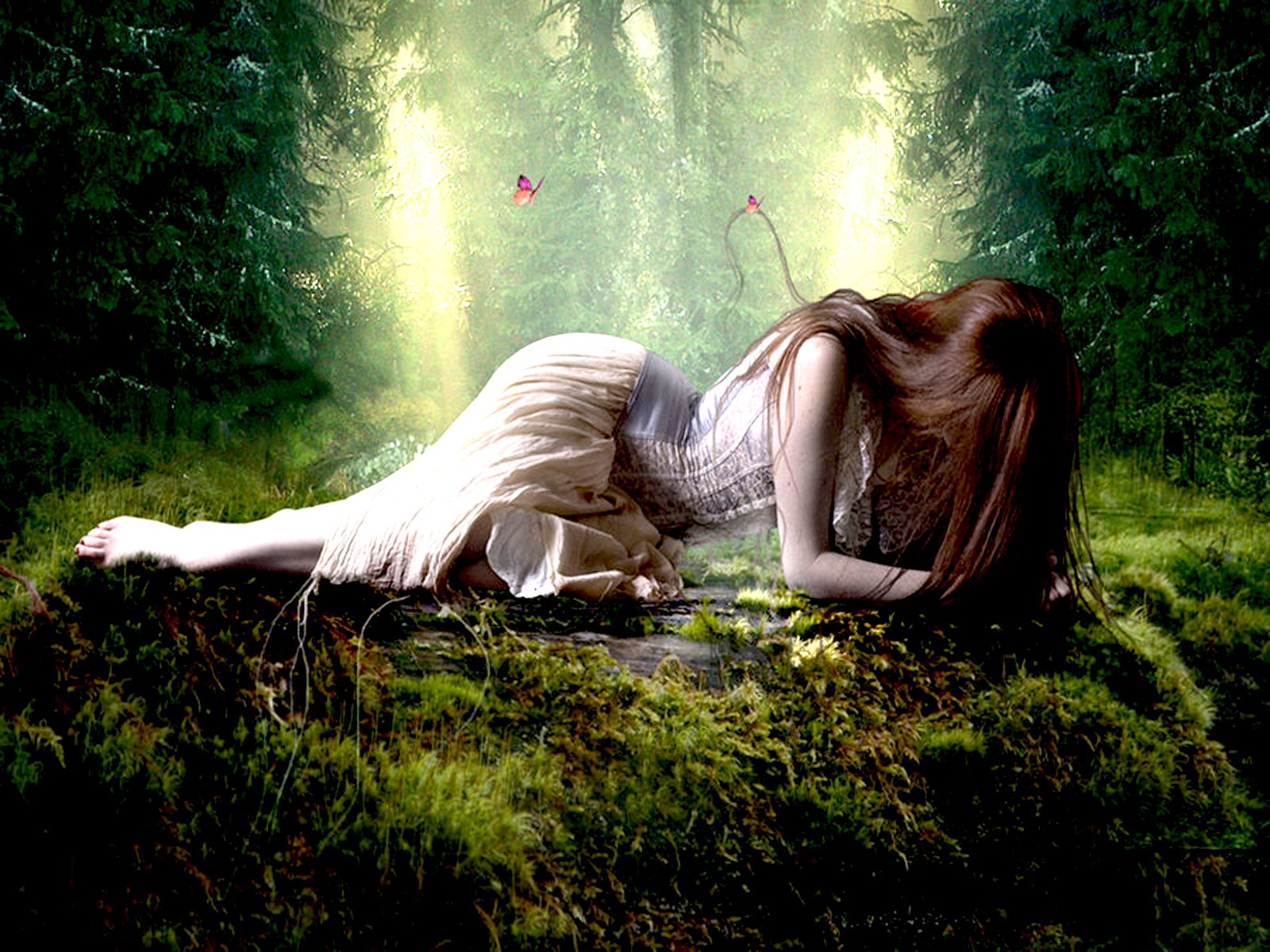 A fantasy-themed HD wallpaper featuring a woman in a flowing dress, reclining on a moss-covered ground amidst a lush, enchanted forest, surrounded by soft, ethereal light.