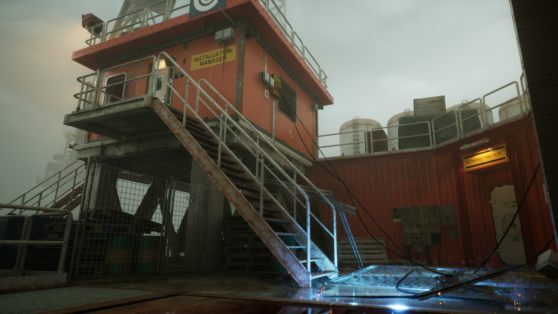 High-definition desktop wallpaper from the video game Still Wakes the Deep, featuring an industrial exterior with metal stairs leading to an upper platform, surrounded by various machinery under an overcast sky.