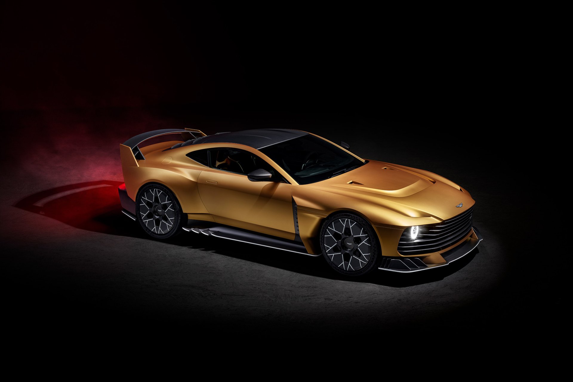 HD desktop wallpaper featuring a sleek, golden Aston Martin Valiant car with a dark background.