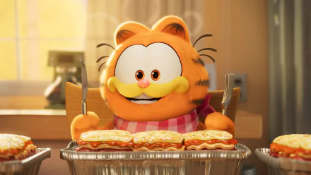 HD wallpaper featuring the animated character Garfield from The Garfield Movie, sitting at a table ready to eat a pie, with a cheerful expression on his face.