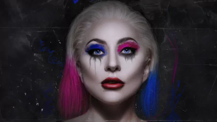 HD desktop wallpaper featuring Lady Gaga with dramatic Joker-inspired makeup, vibrant blue and pink hair for Joker: Folie à Deux.