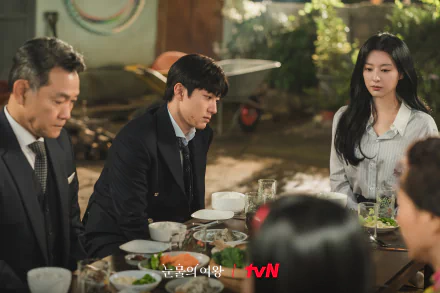 HD wallpaper featuring a scene from the TV show Queen of Tears with three characters at a dining table, displaying the tvN logo.