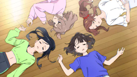 HD anime wallpaper featuring five anime girls lying on the floor, viewed from above, creating a trapezium shape with a warm wooden background.